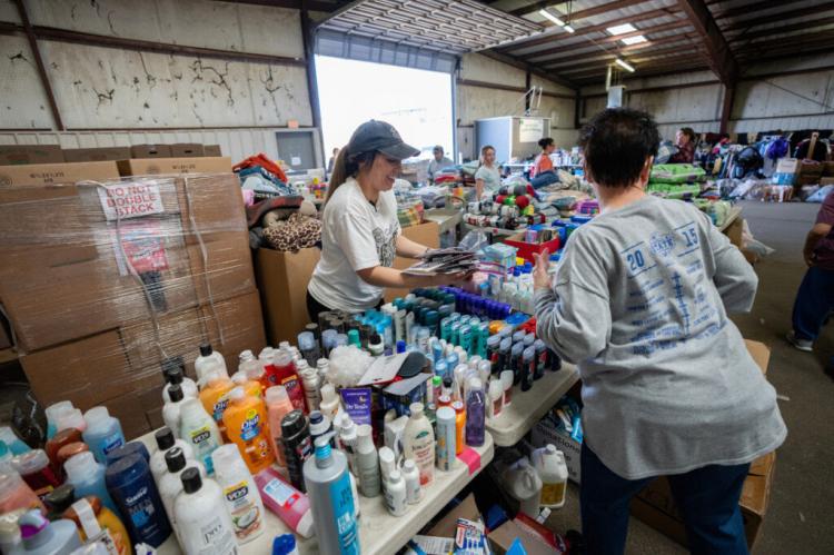 Volunteers take in and sort donated goods at the supply point for human disaster relief in the Hemphill County Exhibition Center run by Texas A&M AgriLife Extension Service office for Hemphill County in Canadian. (Sam Craft/Texas A&M AgriLife)
