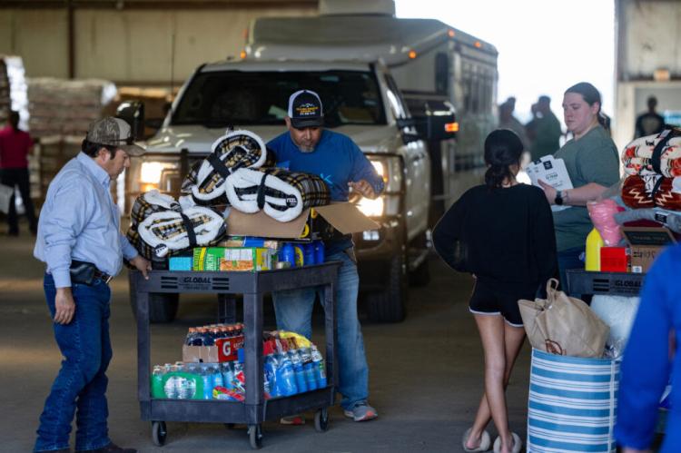 Volunteers take in and sort donated goods at the supply point for human disaster relief in the Hemphill County Exhibition Center run by Texas A&M AgriLife Extension Service office for Hemphill County in Canadian. (Sam Craft/Texas A&M AgriLife)