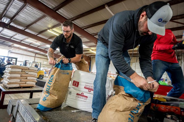Volunteers sort and distribute donated goods at the animal supply point in Canadian. (Texas A&M AgriLife photo by Sam Craft)