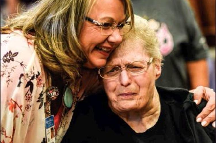 Hemphill County Hospital’s Chief Clinical Officer Debra Sappenfield shares an emotional moment with Edward Abraham Memorial Home(EAMH) resident Carolyn Tucker during the reception prior to Wednesday’s groundbreaking ceremony.