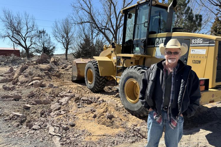 Bo Rankin clearing the debris of his home