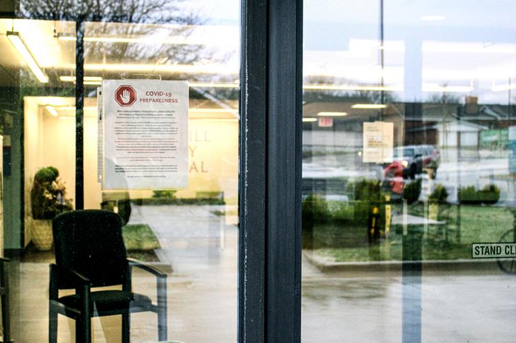 Signs on front door of Hemphill County Hospital warn visitors of the new normal
