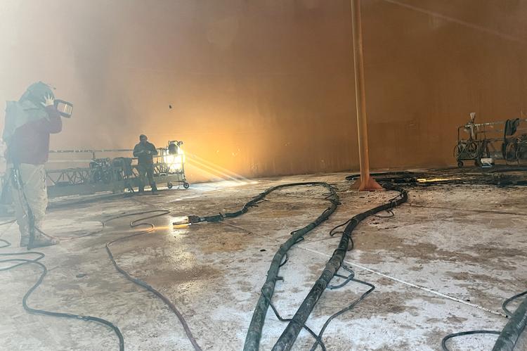 Preparing to sand-blast the tank interior