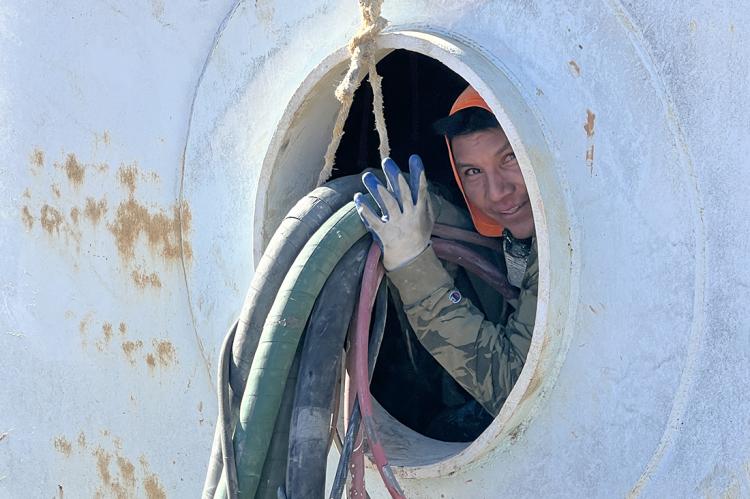 A Viking crew member enters the water tank