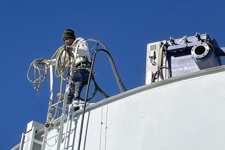 Viking crew member atop the storage tank