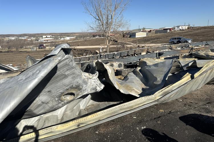 The twisted metal of a mobile home on south edge of Canadian