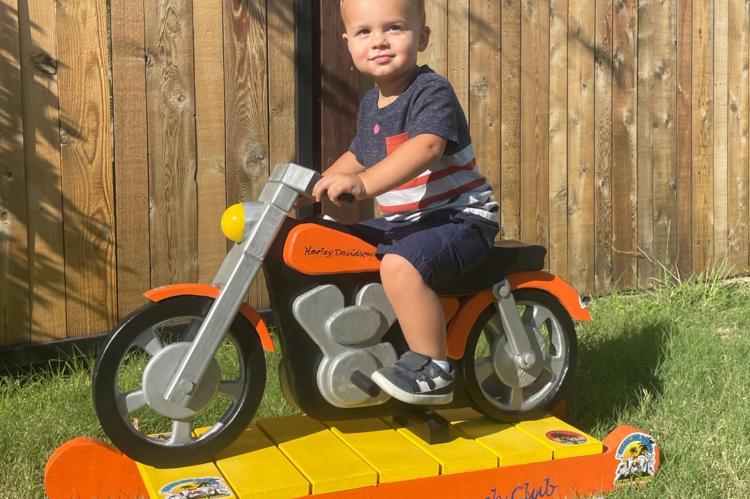 Henry Patrick Crouch on his Rockin' Wood Motorcycle