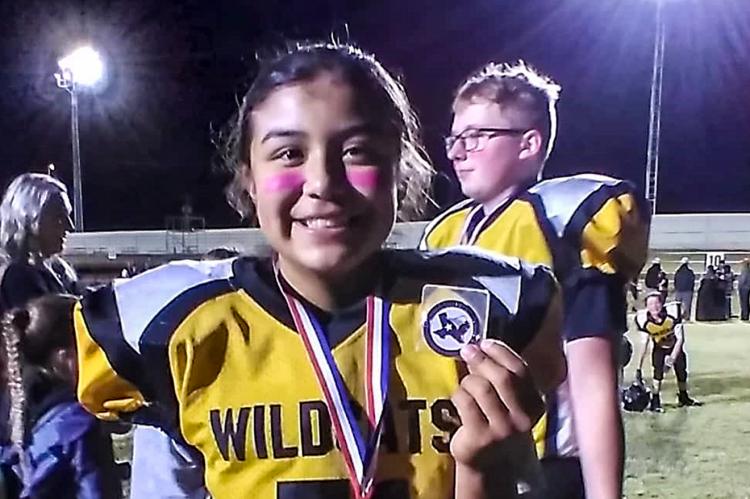 Halfback/Line backer Sharlene Cervantes (51)