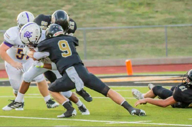 HIT PARADE: Meyer Ray Ancira (9) lowers his shoulder into River Road’s ball carrier, holding the visitors to no gain on the play.