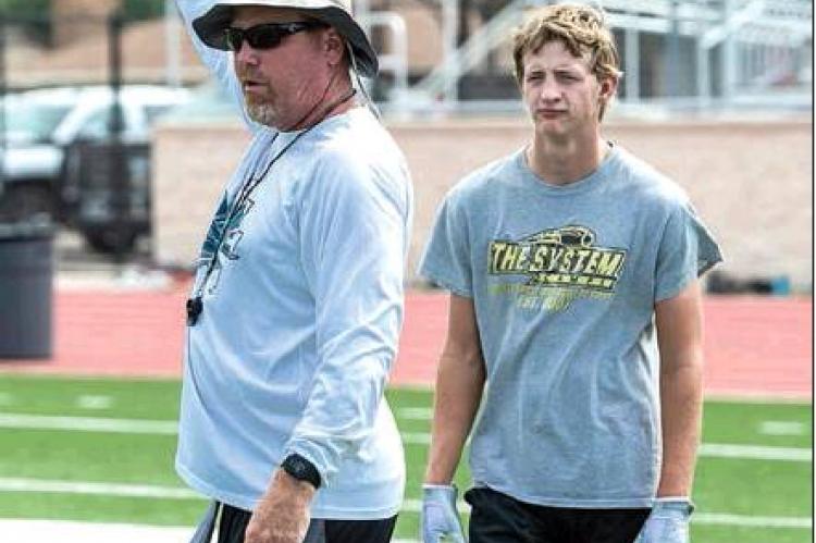 Canadian’s Case In photo at right, Donny Walker (left) is pictured using Canadian’s own Bill Koetting while illustrating drills and attesting to their success to the rest of the camp this week in Stinnett. HALE HUGHES PHOTO