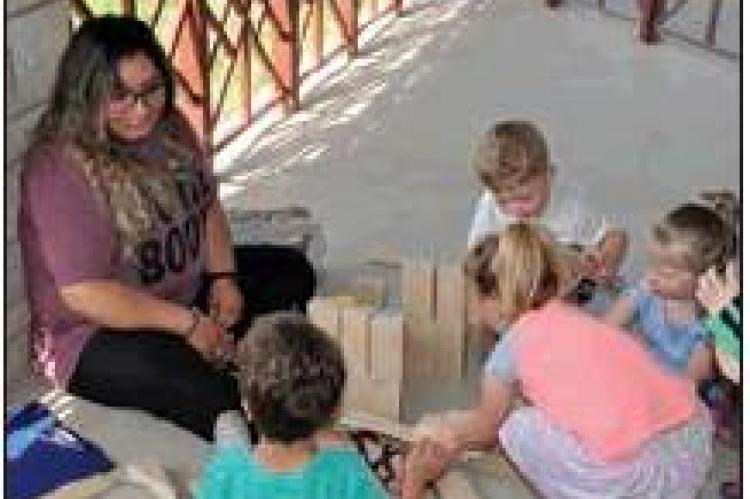 Photo at right: ‘Wonderful 1’s’ Teachers Maria Mena and Karem Ramos; kids