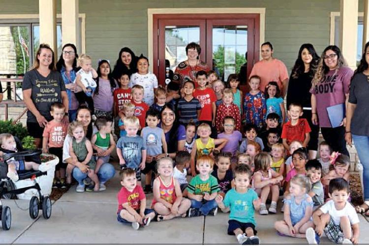 At top: ‘Tremendous 3’s’ Teacher Maria Santoyo with (l-r) Carter Guillen, Bryce LeFever, Charlie LeFever, and Paisley Davis.