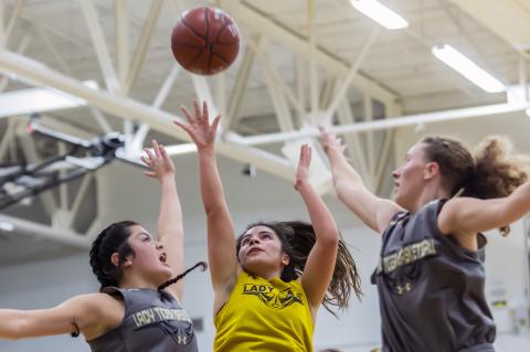 Jasmyn Moreno goes up for a basket between McLean players during Tuesday’s scrimmage.