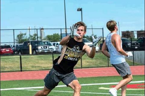 Landon Smith making a reception during receiver drills at the camp HALE HUGHES PHOTO