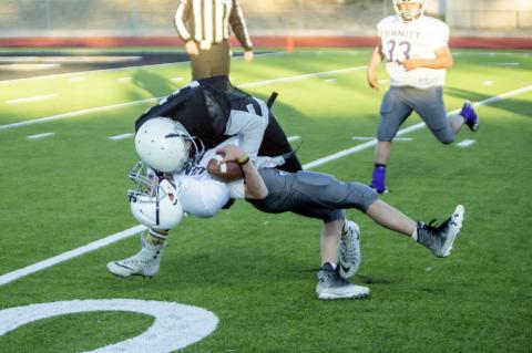 Luke Flowers (35) delivers a monster hit to drop Dimmitt’s quarterback for a huge loss.