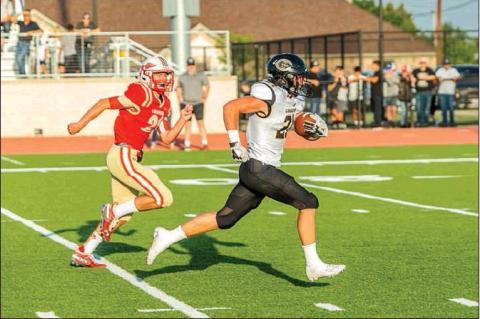 Wildcat On The Loose: Running back Hayze Hufstedler (21) outruns a West Texas defender for a touchdown last Friday night. Hufstedler carried the load for Canadian’s rushing attack, finishing the game with 236 rushing yards for the Wildcats. hale hughes | the record