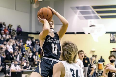 Wildcat player launches a shot in Canadian's loss to the Falcons