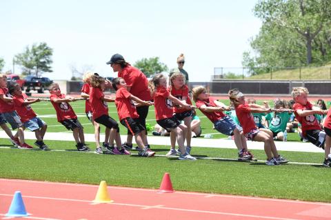 Baxter Landry, Gabriel Vigil, Arian Marquez, Paislee Harrison, Theo Capetillo, Harper Hawkins, Addie Appel, Kaden Wilson, Hailey Sanchez and Cade Bartlett are cheered on by teacher Ana Hernandez (center)