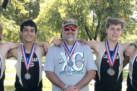 Varsity Boys Cross Country runners Osvaldo Dominguez, Ethan Flowers, Jaxtyn Valenzuela, Coach McCook, George Abraham, Alex Mondragon and Rylun Clark
