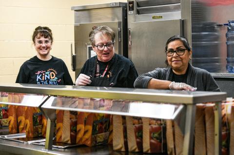 CES staff prepare grab and go meals for CISD students
