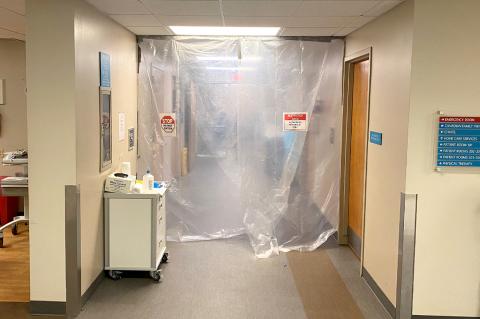 This was the 200 Hall at Hemphill County Hospital in November of 2020. The entryway was draped in plastic, marked with signs warning visitors not to enter. The hall—which had been converted to serve as the hospital’s COVID Unit—was restricted to medical personnel and the acute care patients who were hospitalized there. Local doctors were warning the public that if they had a heart attack or stroke, and were taken to Hemphill County Hospital, they would not be transferred to an acute care unit elsewhere beca