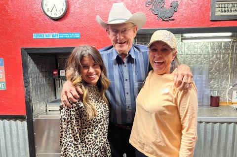 Charlotte “Little Bit” Krodle poses here on Monday with Canadian Restaurant regular Jimmy Schafer and retiring owner Carla Evans. Earlier that day, Evans verified that Joe (not pictured) and Charlotte Krodle are the new owners of the popular dining establishment. Jimmy Schafer beams at hearing the news. 