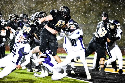 In his 40th career start, defensive lineman Corbin Throgmorton (63) is tapped to carry the ball for a 5-yard touchdown