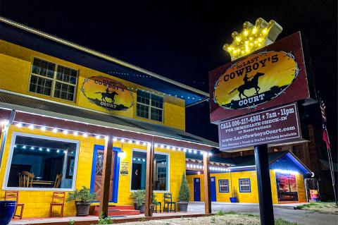 The Last Cowboy’s Court lights up the north end of town, and welcomes travelers on US 60/83 to visit. 