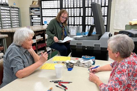 This scene on March 1, 2022, was typical of most election nights at Hemphill County Courthouse, as ballots were fed into a ballot-counting machine and the final tally documented.