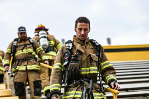 Bryan Bartlett and Andy Ford began their descent, as their fellow firefighters reversed course for the climb to the top.