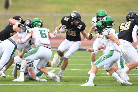 Wildcat O-line Corbin Throgmorton (63) and Nathan Wagner (58) blow open a hole for Luke Flowers' (35) second touchdown run