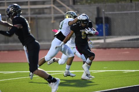 Angel Garcia (5) on one of three TD runs in Friday's victory