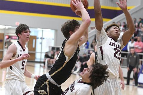 Canadian's Josh Culwell (00) charges the net against Abernathy's Rodriguez (20), White (23), & Myatt (5)