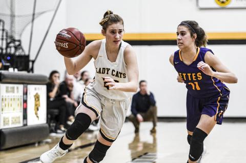 Lady Cat McKenna Cavalier (24) drives the ball downcourt in Tuesday's game