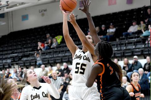 Mattie Boyd (55) looks for net as Briley Merket (12) prepares to rebound