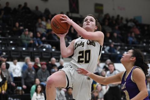 Tinley Pennington (20) putting up 2 of her 17 points scored against the Lady Wolves