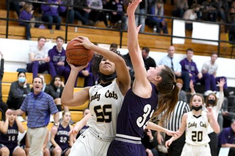 Mattie Boyd (55) outmuscles the Spearman guard to get a look at the basket
