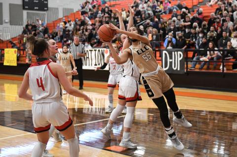 Mattie Boyd (55) get around Shallowater's Summer Williams (15) to find an opening in the fourth quarter