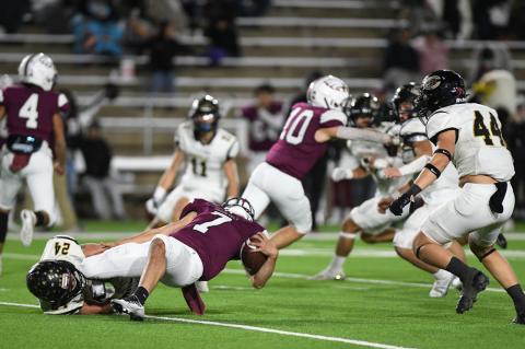 Matt McLanahan (24) downs QB Nate Casarez for a loss, while racking up an impressive 15 tackles, five for losses