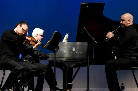 Pianist David Palmer, in a stunning performance here Tuesday evening with violinist Evgeny Zyonnikov and Dr. Guglielmo Manfredi on French horn