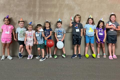 Museum Day Campers show off the tipis they made after touring the Native American display last week 
