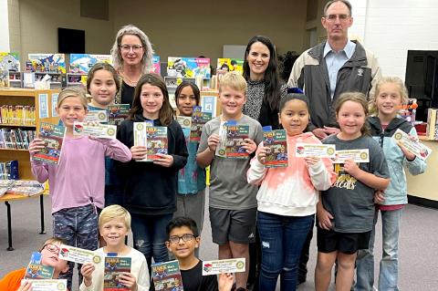Rotarians Anna Booze, Wendie Cook, and Shane Harris pose with members of Heather Lee’s class