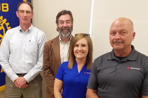 Shane Harris with Xcel Energy representatives Wes Reeves, Laycee Johnson and Ronnie Walker