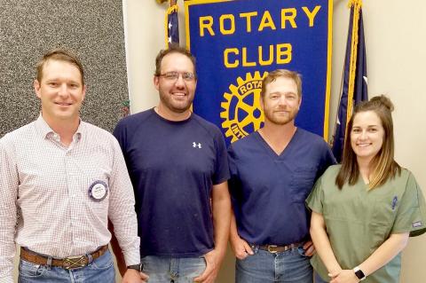 Rotarian Bryce Ward, Doug Crouch, and Brock and Natalie Irwin