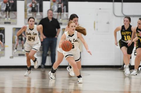 Samantha Krehbiel (5), Tinley Pennington (20), and Ella Walser (24) in Tuesday's win over Happy
