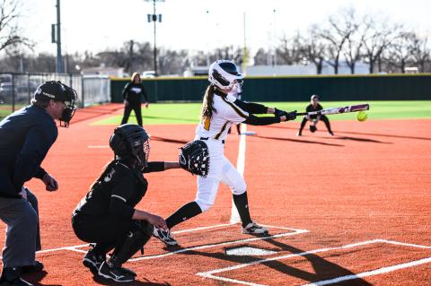 Macey Witt finds the pitch she likes and makes the connection, bringing three runners home
