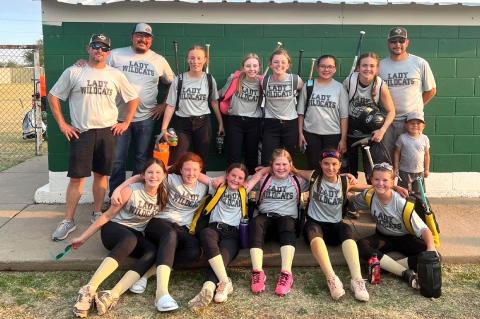 Members of the Lady Cat 12U Softball Club are (front row) Maddy Longoria, Paisley Billings, Lauren Woodrum, Ava Johnson, Kate Escarcega, and Shyanne Blackerby; and (back row) coaches Matthew Woodrum and Juan Guillen, Kenzi Williams, Tessa Eddleman, Claire Wilhelm, Maya Yanez, Landry Appel, Coach Josh Longoria and son Doc.