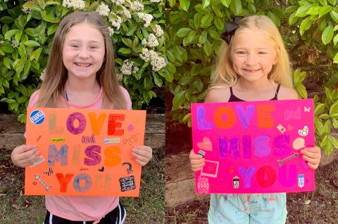 Harper and Hadlee Spencer show support for their teachers.