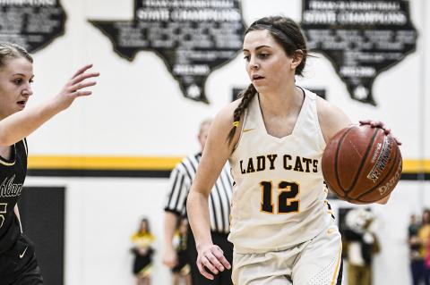 Haley Merket (12) drives downcourt vs Bushland