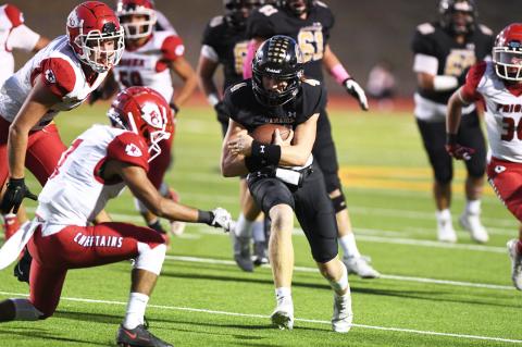 Quarterback Camren Cavalier hangs on to the ball in what was one of 18 carries for 63 yards versus Friona